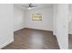 Well-lit bedroom with hardwood floors and a window at 137 Scott Dr, Sanford, FL 32771