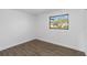 Well-lit bedroom featuring hardwood floors and a window at 137 Scott Dr, Sanford, FL 32771