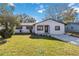 Newly renovated house with a stone facade and a well-manicured lawn at 137 Scott Dr, Sanford, FL 32771