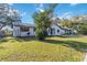Newly renovated house with a stone facade and a well-manicured lawn at 137 Scott Dr, Sanford, FL 32771