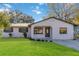 Newly renovated house with a stone facade and a well-manicured lawn at 137 Scott Dr, Sanford, FL 32771