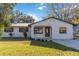Newly renovated house with a stone facade and a well-manicured lawn at 137 Scott Dr, Sanford, FL 32771