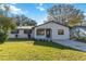 Newly renovated house with a stone facade and a well-manicured lawn at 137 Scott Dr, Sanford, FL 32771