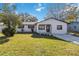 Newly renovated house with a stone facade and a well-manicured lawn at 137 Scott Dr, Sanford, FL 32771