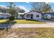 Newly renovated house with a stone facade and a well-manicured lawn at 137 Scott Dr, Sanford, FL 32771