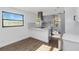 Modern kitchen with gray cabinets, stainless steel appliances, and an island at 137 Scott Dr, Sanford, FL 32771