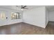 Bright living room featuring hardwood floors and a ceiling fan at 137 Scott Dr, Sanford, FL 32771