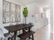 Modern dining area with a large table and built-in bench seating at 1527 Isleta Loop, Kissimmee, FL 34741