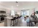 Open concept kitchen with granite countertops and stainless steel appliances at 1527 Isleta Loop, Kissimmee, FL 34741