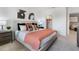Main bedroom with a king-size bed and en-suite bathroom access at 1527 Isleta Loop, Kissimmee, FL 34741
