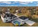 Beautiful aerial view of the property showcasing the pool, detached garage, and basketball court at 1730 Connecticut Ave, St Cloud, FL 34769