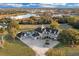 Aerial view of custom home with sparkling pool, three-car garage, and wrap around porch at 1730 Connecticut Ave, St Cloud, FL 34769