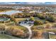 Aerial view of the expansive property showing the pond and neighboring homes at 1730 Connecticut Ave, St Cloud, FL 34769