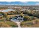 Beautiful aerial shot of a home with a pool, a large yard, and nearby suburban community at 1730 Connecticut Ave, St Cloud, FL 34769