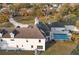 Scenic aerial view of home with a backyard pool, outdoor dining space, and lush landscaping at 1730 Connecticut Ave, St Cloud, FL 34769