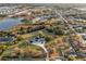 Wide aerial view of the property showing the pond and neighboring homes at 1730 Connecticut Ave, St Cloud, FL 34769