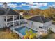 Stunning outdoor space with a large pool, lounge chairs, and a barbecue area for entertaining at 1730 Connecticut Ave, St Cloud, FL 34769