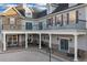 Spacious backyard patio featuring stone accents, covered seating, and stylish outdoor lighting at 1730 Connecticut Ave, St Cloud, FL 34769