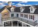Elegant balcony with decorative ironwork, complementing the home's distinctive architectural style at 1730 Connecticut Ave, St Cloud, FL 34769