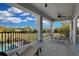 Spacious outdoor balcony with lounge seating overlooking the pool and landscaped yard at 1730 Connecticut Ave, St Cloud, FL 34769