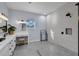 Modern bathroom featuring a spacious vanity area and walk-in shower with white tiled walls at 1730 Connecticut Ave, St Cloud, FL 34769
