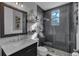 Modern bathroom features sleek gray tile, glass shower, and stylish vanity at 1730 Connecticut Ave, St Cloud, FL 34769