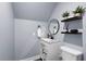 Modern half bath features granite countertop, plants, and contemporary fixtures at 1730 Connecticut Ave, St Cloud, FL 34769