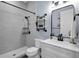 Updated bathroom featuring walk-in shower, sleek hardware, modern vanity and updated tile and lighting at 1730 Connecticut Ave, St Cloud, FL 34769