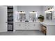Updated bathroom featuring a double vanity, sleek hardware, modern tile, and shelving at 1730 Connecticut Ave, St Cloud, FL 34769