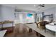 Bright bedroom with balcony access, complemented by a ceiling fan and tasteful decor at 1730 Connecticut Ave, St Cloud, FL 34769