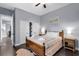 Comfortable bedroom with dark floors, light blue walls, two closets, and a well-lit interior at 1730 Connecticut Ave, St Cloud, FL 34769