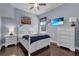 Inviting bedroom boasts dark wood floors and television at 1730 Connecticut Ave, St Cloud, FL 34769