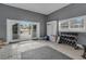 Well-lit exercise room with open patio access featuring free weights and exercise equipment at 1730 Connecticut Ave, St Cloud, FL 34769