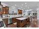 Beautiful kitchen with island, stainless appliances, and dark wood cabinetry at 1730 Connecticut Ave, St Cloud, FL 34769