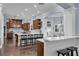 Open kitchen with dark wood cabinets, a large island with seating, and a breakfast bar at 1730 Connecticut Ave, St Cloud, FL 34769