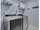 Well-equipped laundry room features modern washer and dryer units at 1730 Connecticut Ave, St Cloud, FL 34769