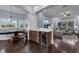 Open concept living area with breakfast nook, wet bar, and hardwood floors at 1730 Connecticut Ave, St Cloud, FL 34769