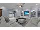 Living area with a ceiling fan, built-in shelves and a TV at 1730 Connecticut Ave, St Cloud, FL 34769
