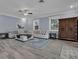 Comfortable living room with a large sectional sofa, and a dark wood cabinet at 1730 Connecticut Ave, St Cloud, FL 34769