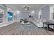 Cozy living room featuring light blue walls, built-in shelving, and a comfortable sectional sofa at 1730 Connecticut Ave, St Cloud, FL 34769