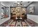 Spacious office boasts a large desk, wood wall, and ample natural light at 1730 Connecticut Ave, St Cloud, FL 34769