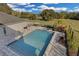 Inviting backyard pool with sun loungers, spa, and beautifully landscaped surroundings at 1730 Connecticut Ave, St Cloud, FL 34769
