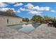 Beautiful backyard pool with comfortable lounge chairs and a serene, inviting atmosphere at 1730 Connecticut Ave, St Cloud, FL 34769