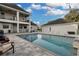 Inviting pool and patio area with ample seating, perfect for entertaining and enjoying the outdoors at 1730 Connecticut Ave, St Cloud, FL 34769