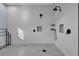 An open walk-in shower with dual shower heads, modern tile and sleek fixtures at 1730 Connecticut Ave, St Cloud, FL 34769