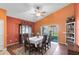 Bright dining room with hardwood floors, a formal dining set and sliding glass doors to the patio at 290 Clydesdale Cir, Sanford, FL 32773