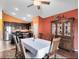 Dining room with wood floors, a large table, and access to the backyard at 290 Clydesdale Cir, Sanford, FL 32773