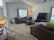 Bright living room features neutral decor and plush carpeting, creating a cozy atmosphere at 290 Clydesdale Cir, Sanford, FL 32773