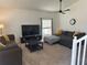 Inviting living room with a large window, neutral carpet, and comfortable sofas at 290 Clydesdale Cir, Sanford, FL 32773