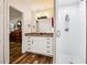 Modern bathroom featuring a walk-in shower, granite counters, and wood look floors at 2935 Antique Oaks Cir # 64, Winter Park, FL 32792